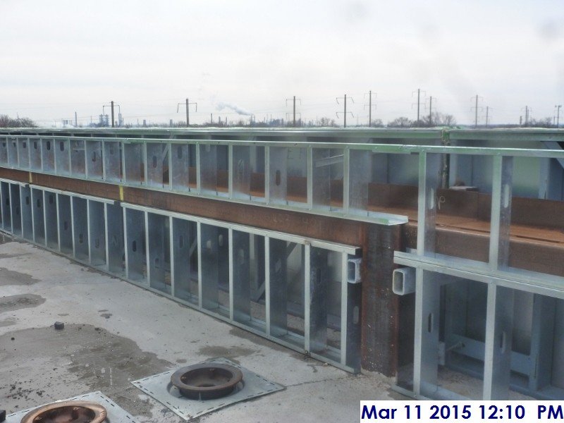 Metal framing around the perimeter of the lower roof Facing West